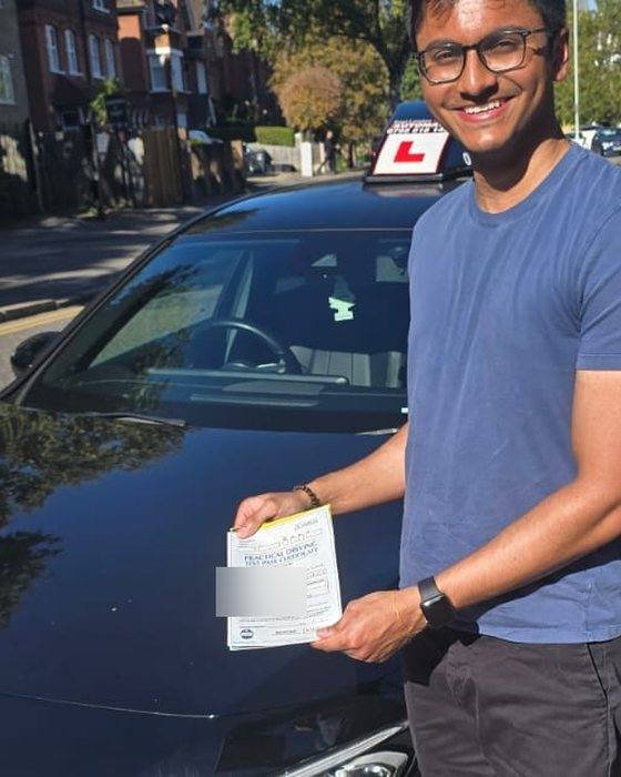 Automatic test pass — East London — learner with their pass certificate beside the East London Learners automatic car