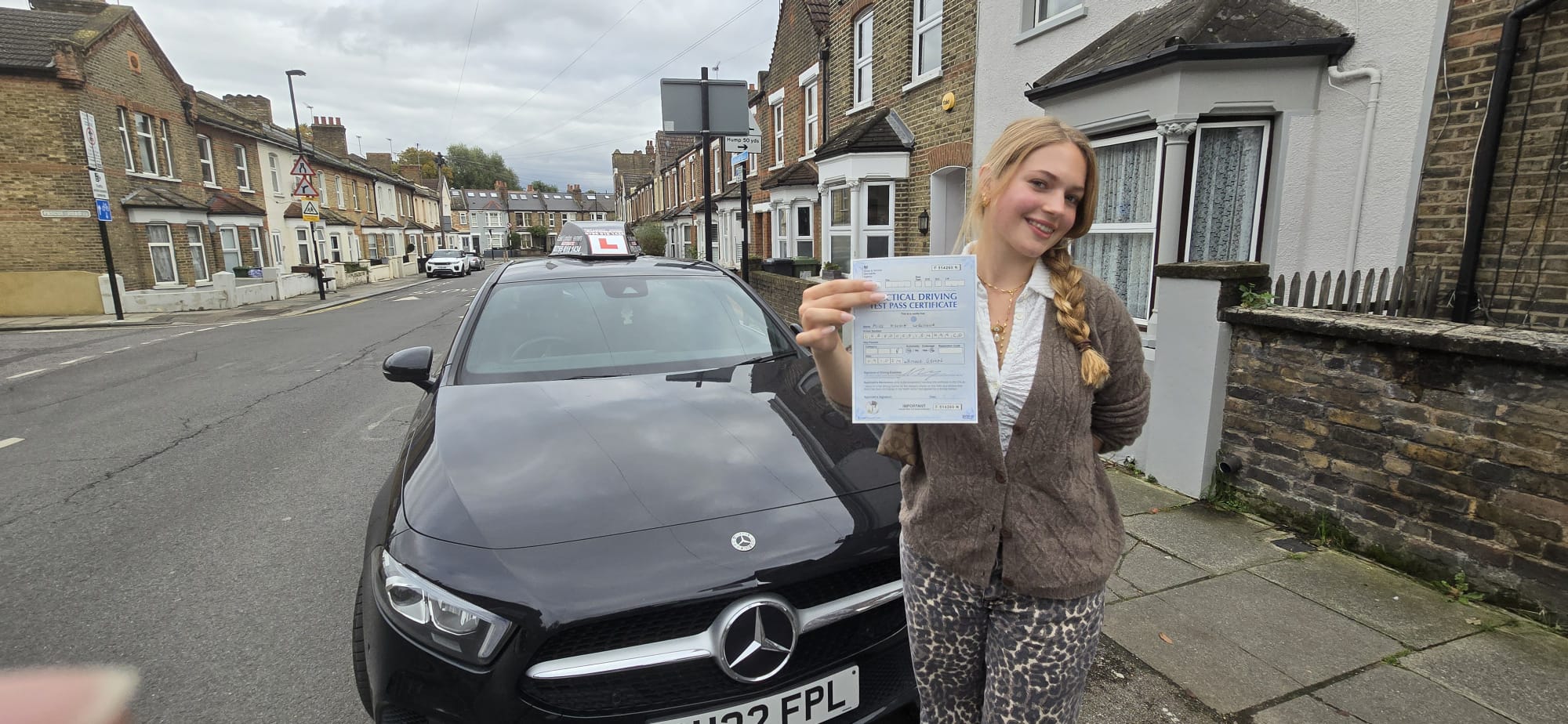 Learner celebrating passing their test with automatic driving lessons in East Ham.