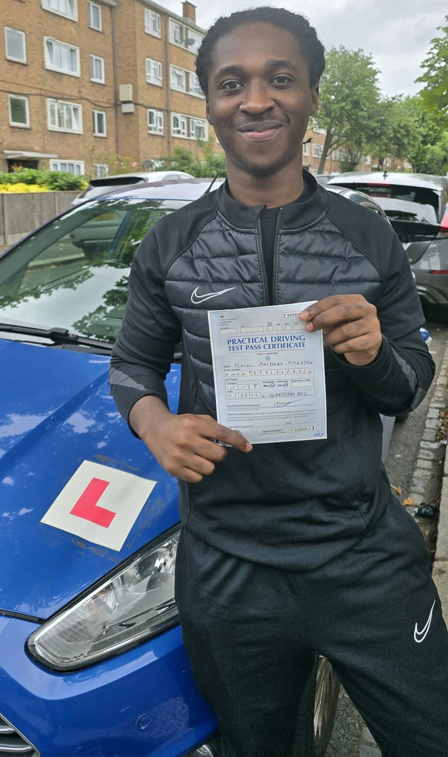 Excited student completing affordable automatic driving lessons in East Ham.